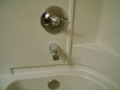 When were the water control valves for bathtubs first required to be temperature limiting (single handle)?