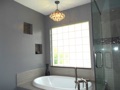 Why can't I put a chandelier over the spa tub in my master bath? It would look wonderful!