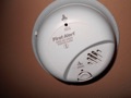What is the best place to install carbon monoxide alarms (CO detectors) in a house?