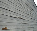 What is the difference between composite and regular wood siding?
