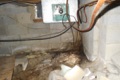 Is it acceptable for an air conditioning condensate drain line to terminate under the house?