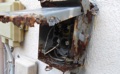 When should a corroded or damaged electric panel cabinet or disconnect box be replaced?