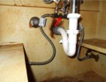 How does a retrofit hot water recirculation system work?