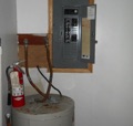 How far away do plumbing pipes have to be from an electrical panel?
