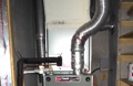 What is the minimum slope of a flue connector for a gas furnace or water heater?
