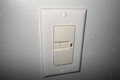 What is the switch on the wall with two pushbuttons?