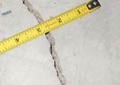 How can I tell if cracks in the garage floor are a problem or not?