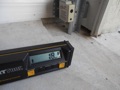 What is the minimum slope for a garage floor slab?