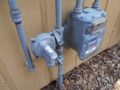 Is it normal to smell gas near a natural gas meter?