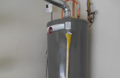 Where are gas water heaters not allowed to be installed?