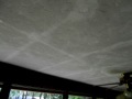 What causes dark or light ghost lines on ceilings and walls?