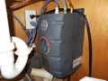 How do I tell the age of an Insinkerator instant hot water heater from the serial number?