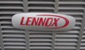 How can I tell the age of a Lennox heat pump or air conditioner from the serial number?