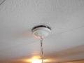 What is the top of a hanging light fixture called?