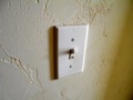 Does a light switch have to be in the same room as lights?