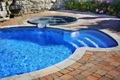 What are the pros and cons of vinyl liner vs fiberglass vs concrete in-ground pools?