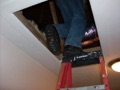 Can an attic access hatch be in a kitchen, bathroom, or bedroom?