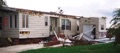How much will a category 5 hurricane damage a mobile home?