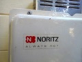 How do I tell the age of a Noritz water heater from the serial number?