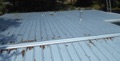 How do you flash skylight, chimney, and pipe vent roof penetrations on a metal roof?