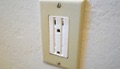 Why does painting an electric receptacle (outlet) make it unsafe?