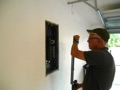 Is an inspector required to open an electrical panel cover (dead front) during a four point inspection?