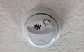 What is the HUD-code minimumum requirement for smoke alarms in a manufacture/mobile home?