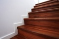 What is the minimum step depth (tread) allowed on a stair?