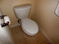 How does a home inspector check a toilet?