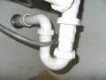 Why is it a problem when a trap under a sink is installed backwards?