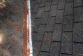 Why is it a mistake to replace a roof and not replace its flashings?