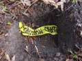 What does it mean when I find buried yellow CAUTION tape when digging a hole in the yard?