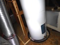 What are the building code requirements for installing an appliance (furnace, air handler, water heater) in the attic?