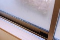 What causes sweating (condensation) on the inside of windows in the winter?